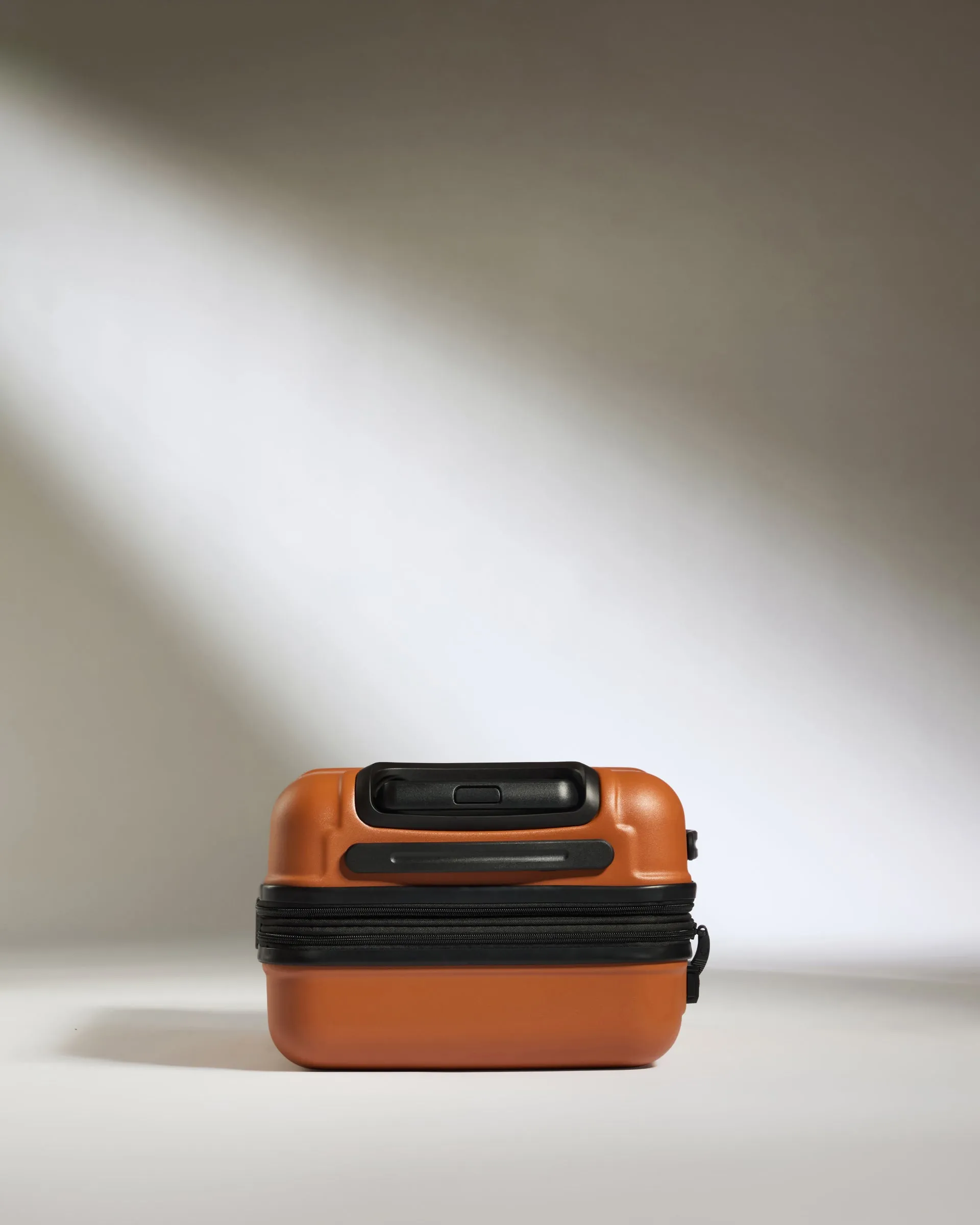 Expandable Carry-on Luggage in Amber - Logo