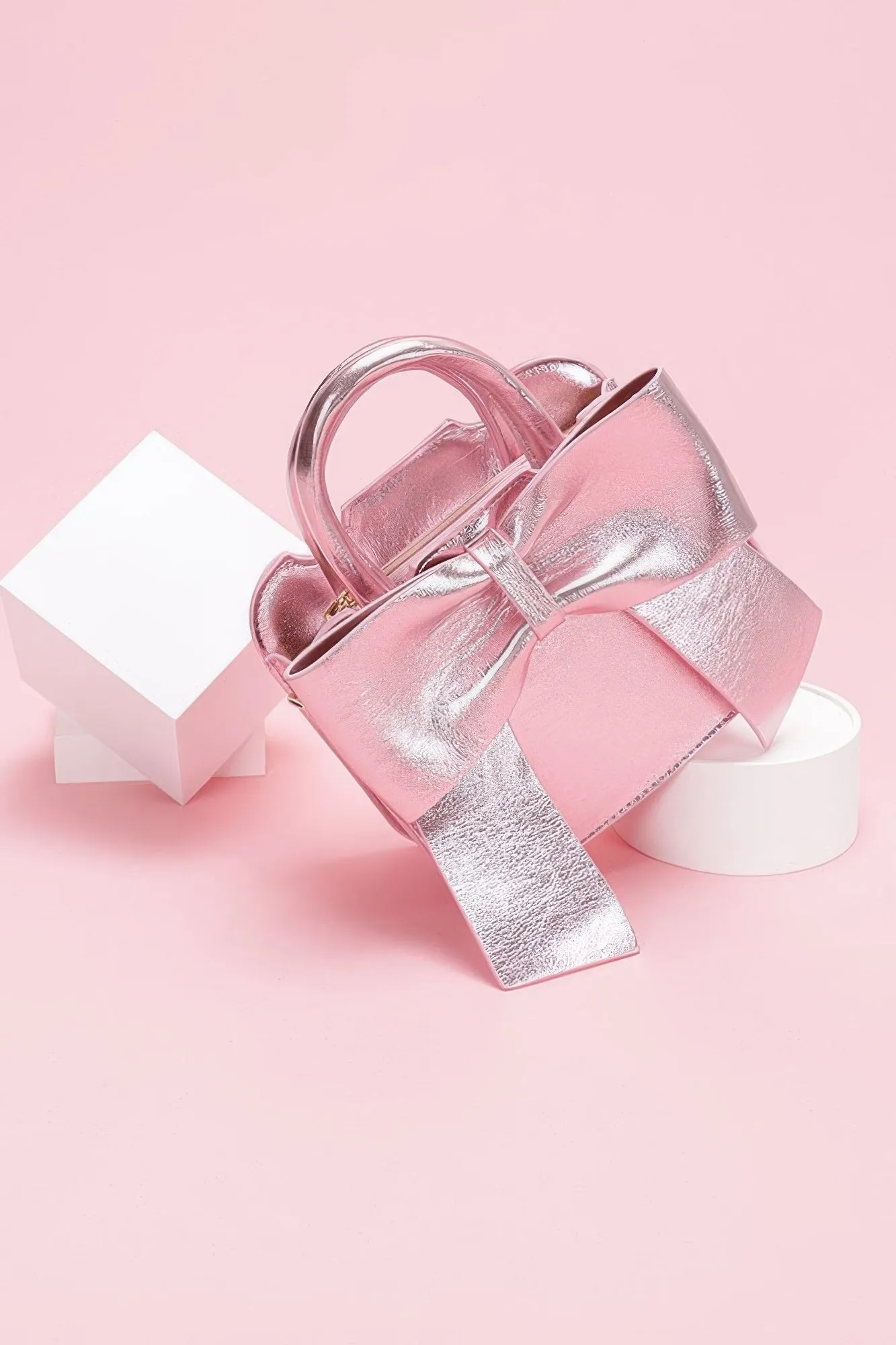 Metallic Bow Front Top Handle Clutch